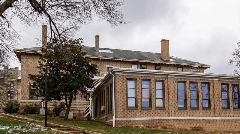 College building has wind damaged shingles and needs a new roof in rolla mo